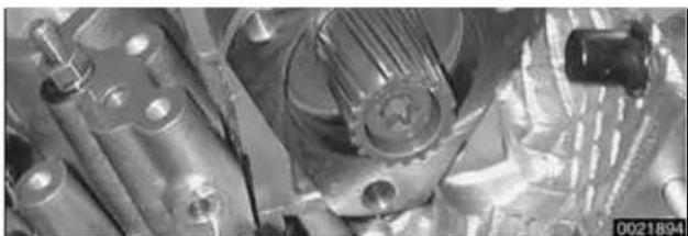 Close-up of mechanical components including gears and shafts (no visible text or symbols).