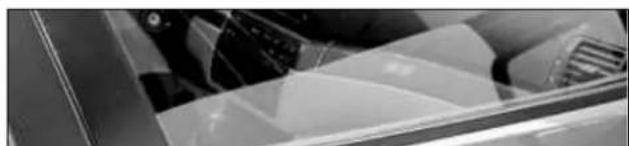 Close-up of a mechanical component with layered surfaces and ventilation (no visible text or symbols)