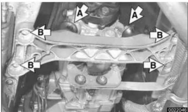 Interior view of an automotive engine bay with visible hoses, valves, and structural components (no text or symbols)