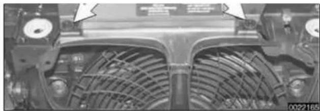 Close-up of a mechanical component with visible heat exchangers and mounting holes (no text or symbols).