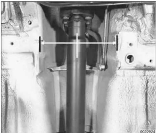Mechanical assembly diagram showing a vertical shaft and mounting components (no text or labels visible)