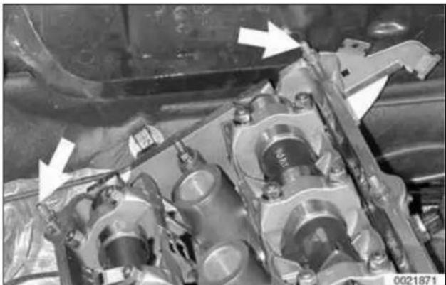 Close-up of an engine cylinder assembly with visible mechanical components and mounting brackets (no text or symbols)