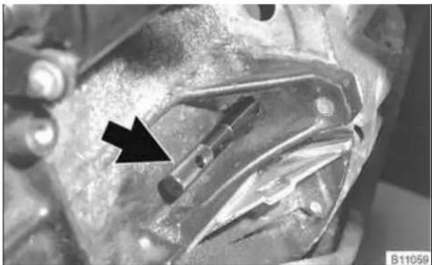 Close-up of mechanical components with a black arrow pointing to a specific part (no visible text or symbols)