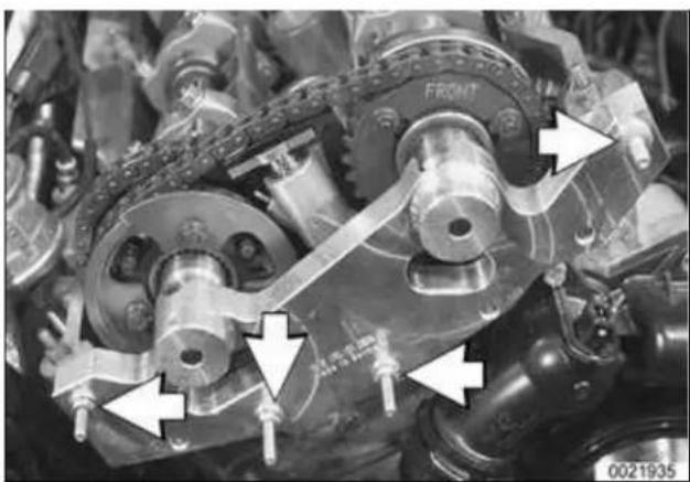 Close-up of mechanical components with arrows pointing to features, no visible text or symbols