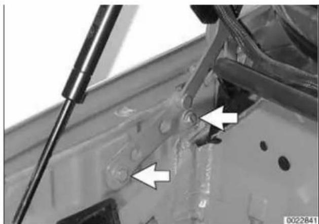 Close-up of a mechanical component with arrows pointing to specific parts, no visible text or symbols