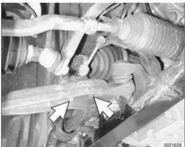 Close-up of mechanical components with hoses and connectors, no visible text or symbols