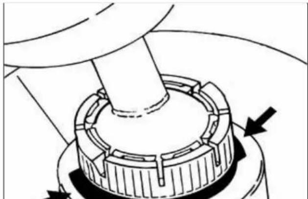 Mechanical assembly diagram showing a rotating component with arrows indicating motion direction (no text or symbols)