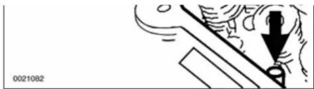Illustration of a hand pressing down on a mechanical component with a downward arrow (no text or symbols)