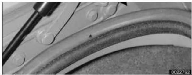 Close-up of a mechanical component with a tool and curved surface (no visible text or symbols)