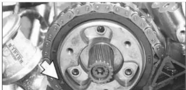 Close-up of a mechanical gear assembly with a central hub and mounting holes (no visible text or symbols)