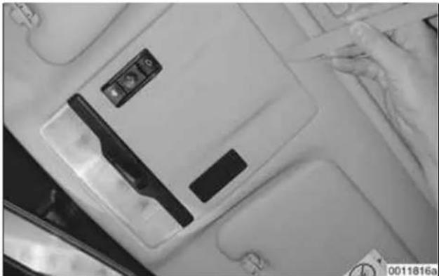 Interior view of a car dashboard with control panel and side seat (no visible text or symbols)
