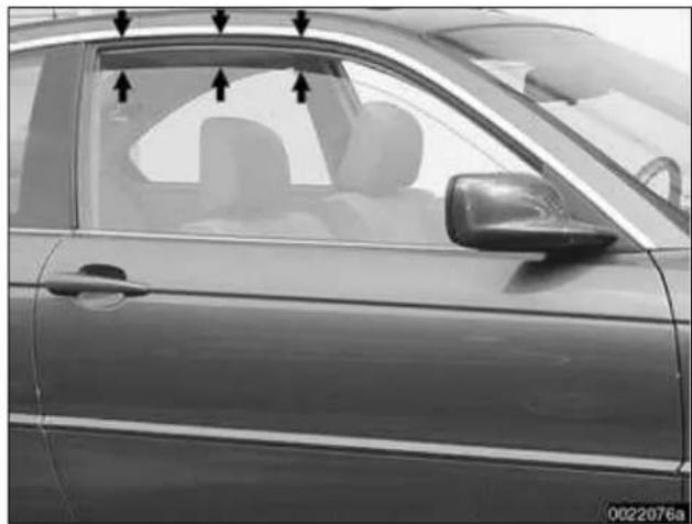 Side view of a car's front window with visible door and seat, no text or symbols present