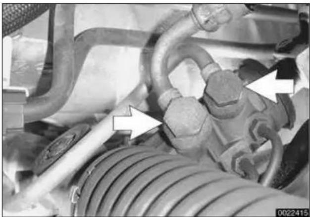 Close-up of mechanical components with pipes and springs, no visible text or symbols