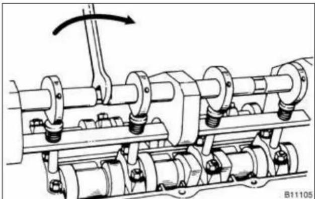 Mechanical assembly diagram showing interconnected pipes and gears with a rotating shaft (no text or symbols)