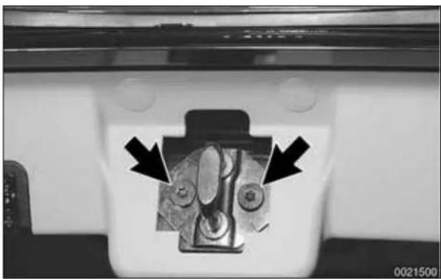 Close-up of a mechanical component with two black arrows pointing to features, no visible text or symbols.