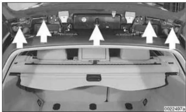 Top-down view of a car's rear engine compartment showing structural components and airflow arrows (no text or symbols)
