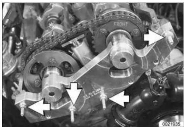 Close-up of mechanical components with directional arrows indicating movement or assembly (no readable text or symbols)