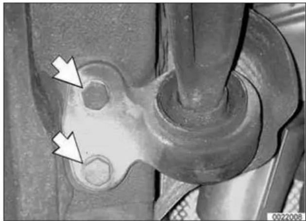 Close-up of a mechanical component with two white arrows pointing to features, no visible text or symbols.