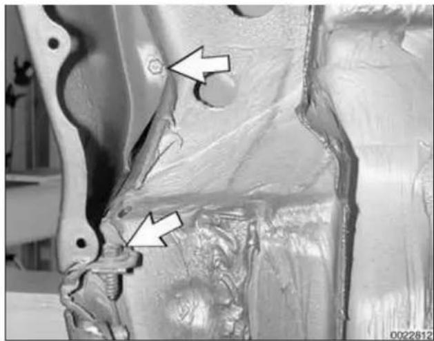 Medical imaging of a joint with two white arrows pointing to specific areas (no text or symbols present)