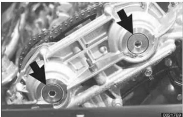 Close-up of mechanical components with arrows pointing to specific parts (no visible text or symbols)