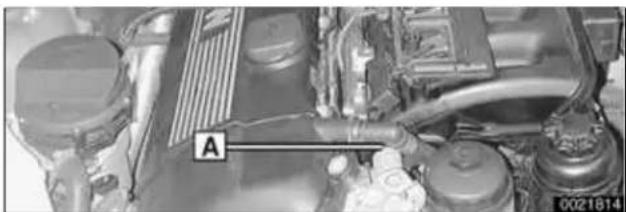 Close-up of a car engine bay with visible components and no readable text or symbols