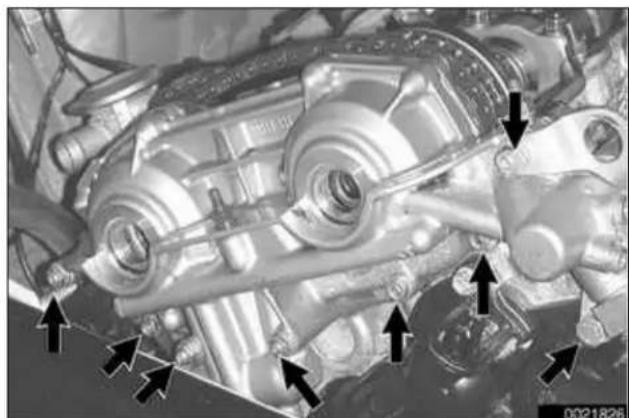 Close-up of an engine component with multiple ports and mounting features, no visible text or symbols