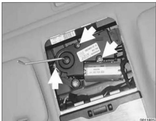 Interior view of a computer case with visible battery and mechanical components (no text or symbols)