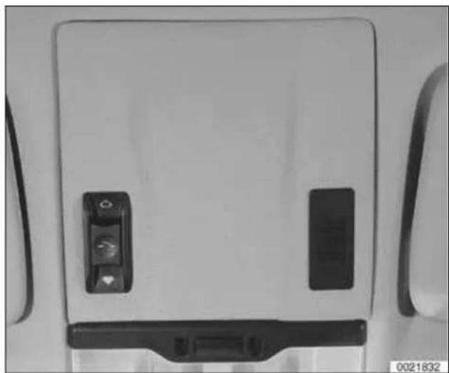 Front view of a white electronic device with two black buttons and a handle, no visible text or symbols.