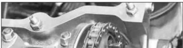 Close-up of mechanical components with bolts and a central coupling (no visible text or symbols)