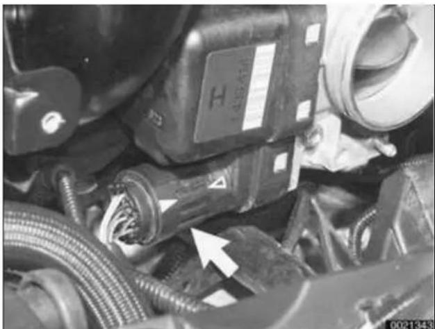Close-up of mechanical components with hoses and connectors, no visible text or symbols