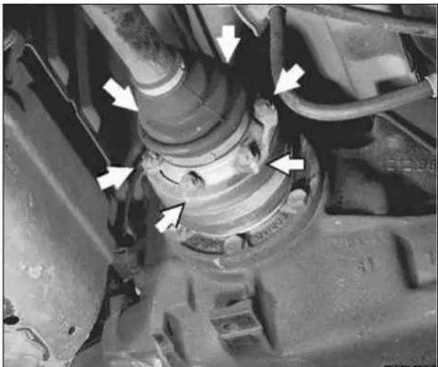 Close-up of a mechanical assembly with white arrows pointing to specific components (no visible text or symbols)