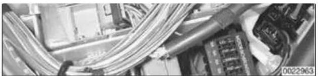 Close-up of electronic equipment with coiled cables and connectors (no visible text or symbols)
