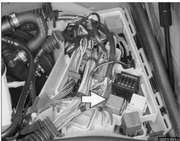 Interior view of a cluttered electrical cabinet with bundled cables and connectors (no visible text or symbols)