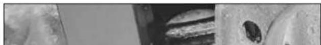 Close-up of a textured surface with two dark circular artifacts (no visible text or symbols)