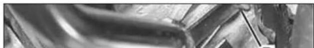 Close-up of metallic curved surfaces with no visible text or symbols
