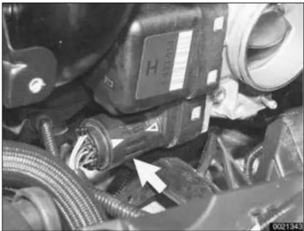 Close-up of mechanical components with hoses and connectors, no visible text or symbols