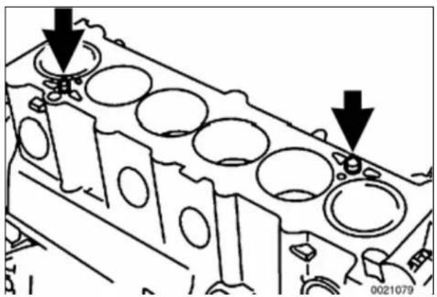Technical diagram of an engine cylinder head with two downward arrows indicating specific components (no text or labels present)