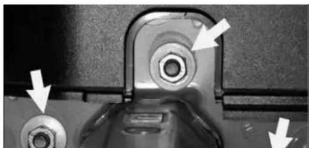 Close-up of a mechanical component with two bolts and a central bolt, showing directional arrows (no text or symbols)