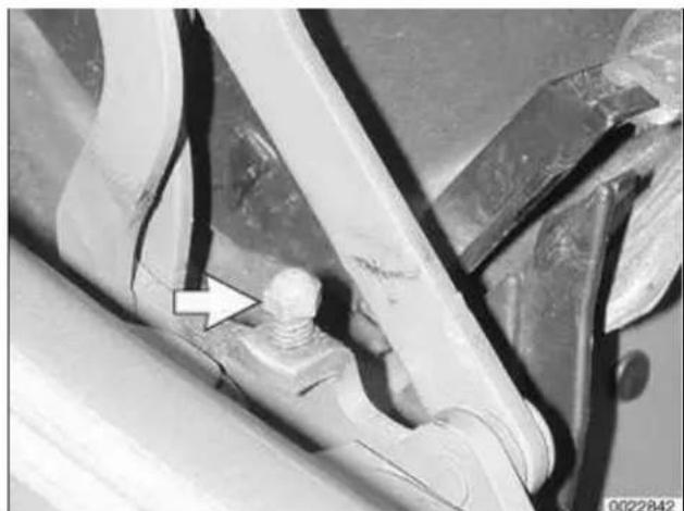 Close-up of a mechanical component with a bolt and cable, no visible text or symbols