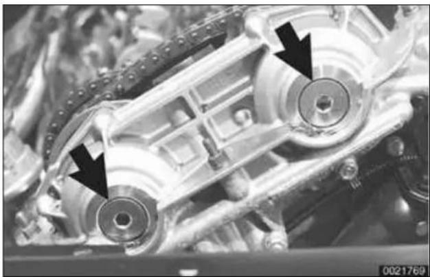 Close-up of mechanical components with arrows pointing to specific parts (no visible text or symbols)
