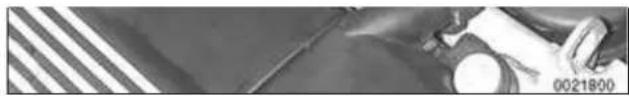 Close-up of a mechanical component with striped pattern and white circular element (no visible text or symbols)