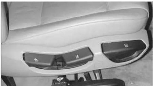 Interior view of a car seatbelt with two side seats and a vehicle wheel (no visible text or symbols)