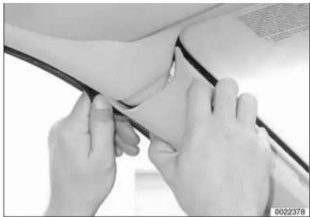 Close-up of hands performing a medical procedure on a patient's arm, no visible text or symbols