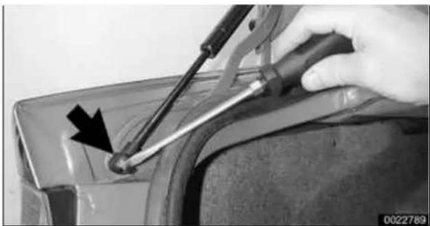 Close-up of a hand using a screwdriver to adjust a small mechanical component (no visible text or symbols)