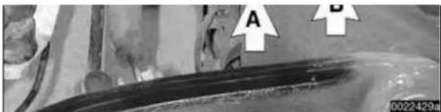 Close-up of a mechanical component with labeled points A and B, showing no readable text or symbols.