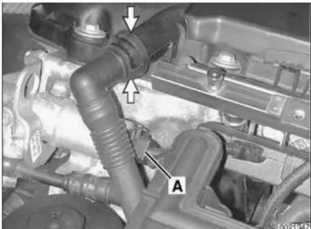 Close-up of an engine cylinder with labeled parts (A and arrows), no readable text or symbols beyond labels