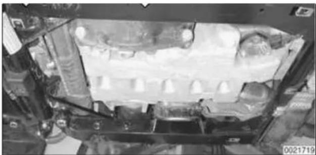 Interior view of a vehicle chassis frame with visible battery and housing (no text or symbols)