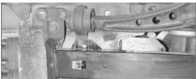 Close-up of mechanical components including gears and a metal frame (no visible text or symbols)