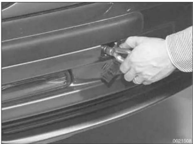 Close-up of a hand adjusting a car door handle, no visible text or symbols