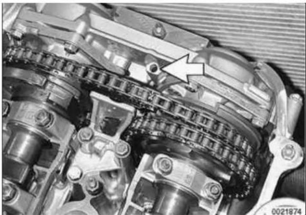 Close-up of an internal combustion engine cylinder assembly with a highlighted arrow indicating a specific component (no text or symbols present)